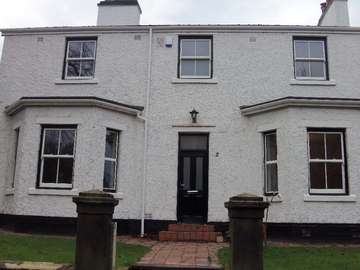 Mr & Mrs A. Eastham Village - Bygone Collection whitewood sash windows - PvcU with Conservation officer approval. Black outer frames with whitewood sashes Upvc sliding sash windows liverpool